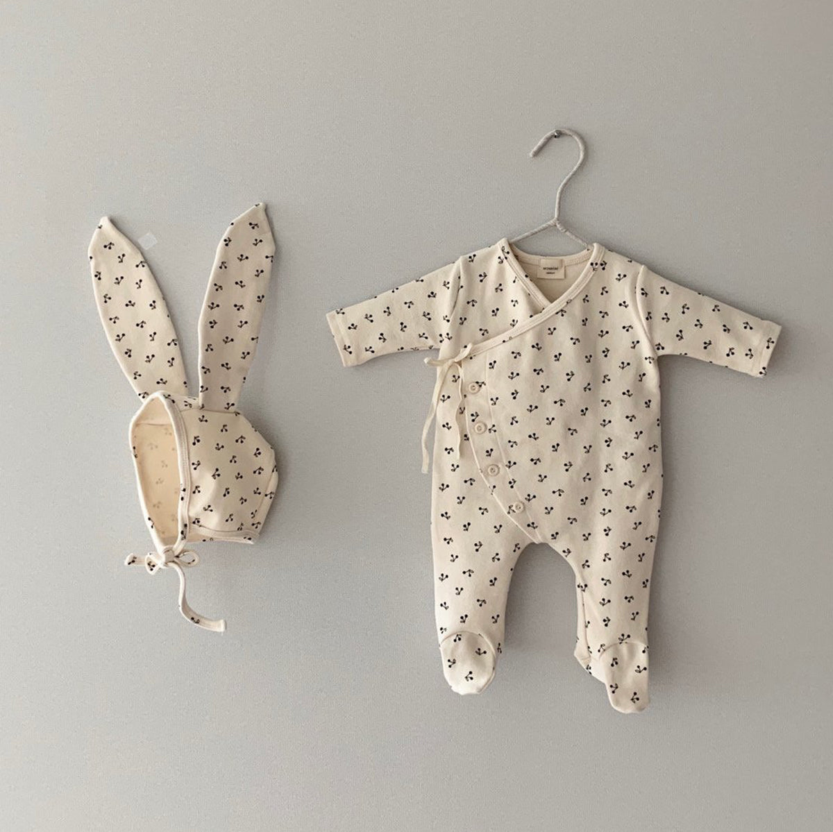 A set of cherry suit and bonnet